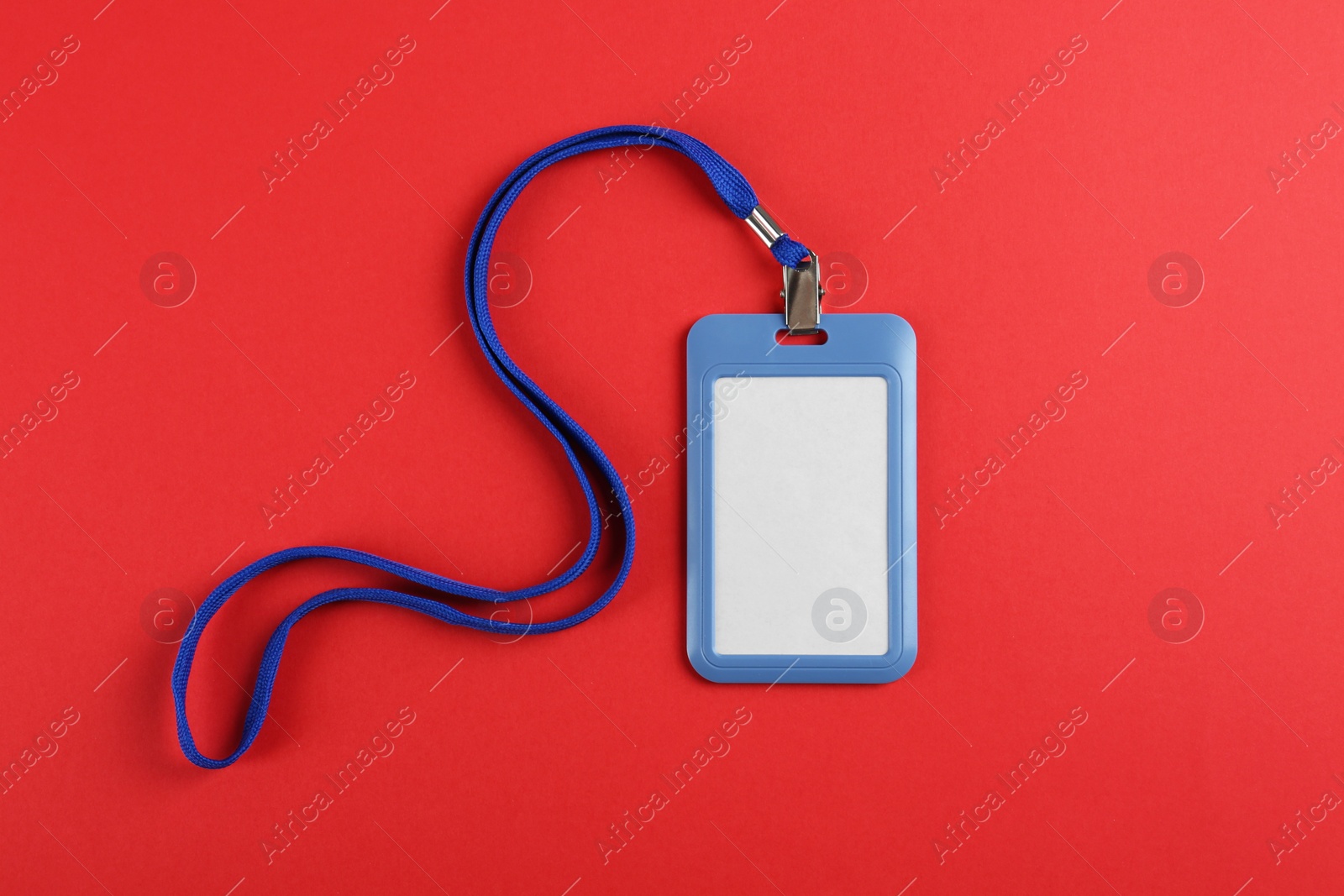 Photo of Blank badge on red background, top view. Mockup for design