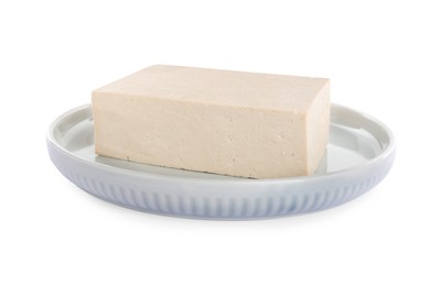 Photo of Plate with delicious raw tofu isolated on white