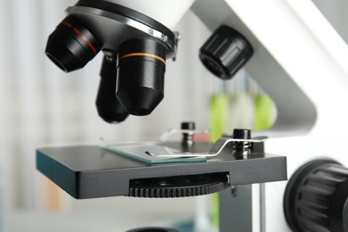 Modern microscope with different lenses in laboratory, closeup. Medical equipment