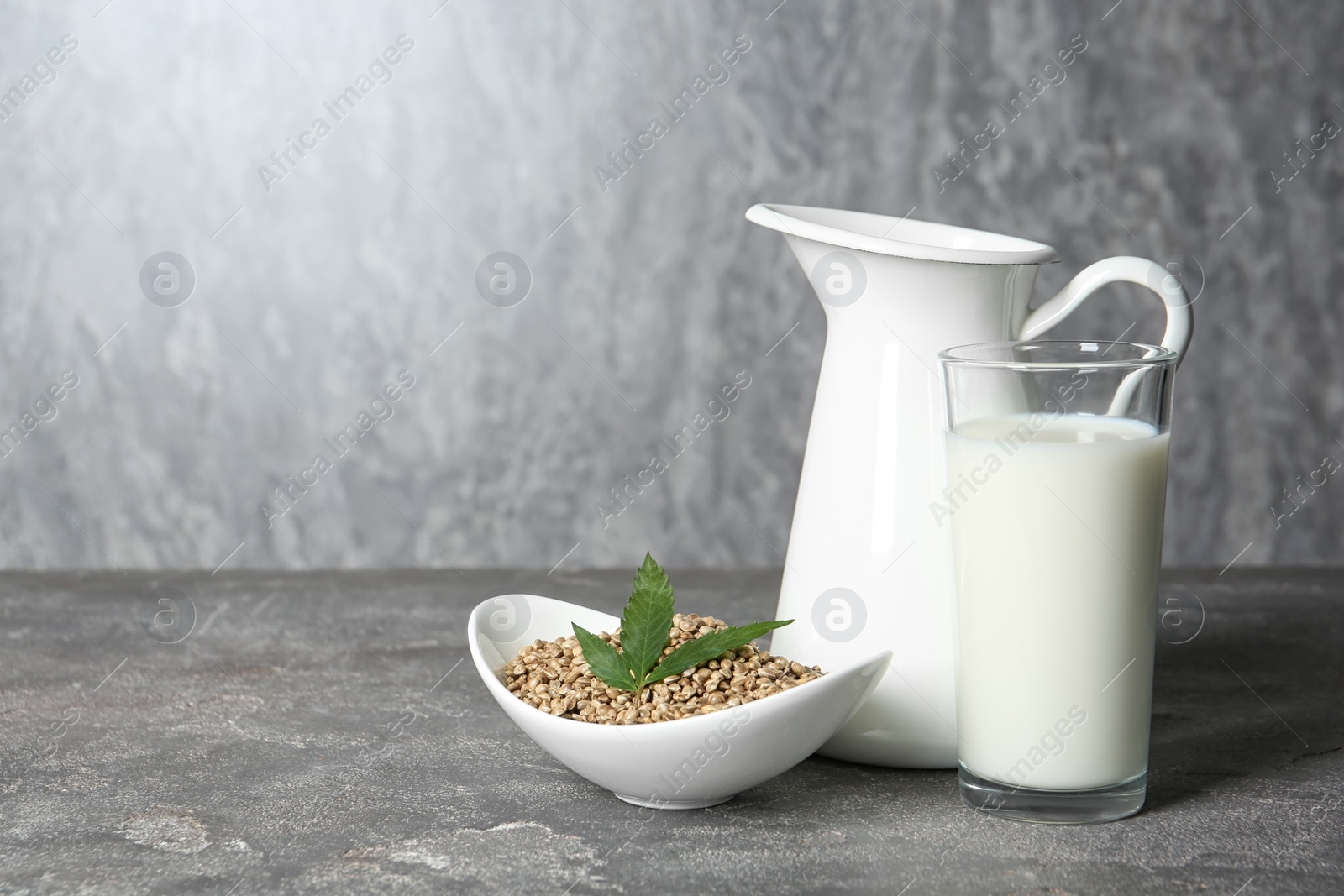 Photo of Composition with hemp milk and space for text on grey background