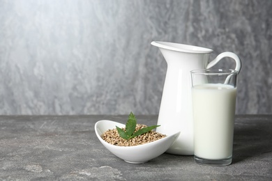 Composition with hemp milk and space for text on grey background