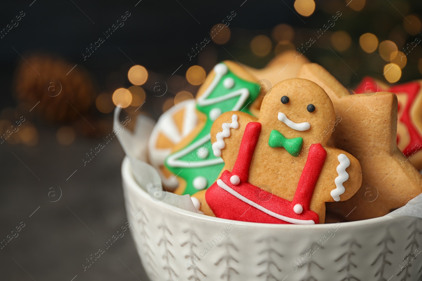 Photo of Tasty homemade Christmas cookies on dark grey table, closeup view