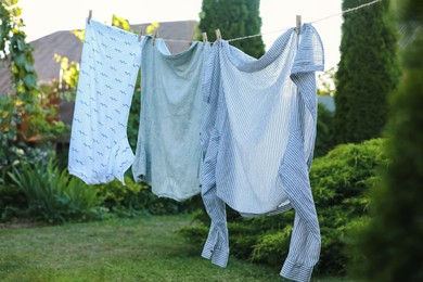 Photo of Shirts drying on washing line at backyard of house