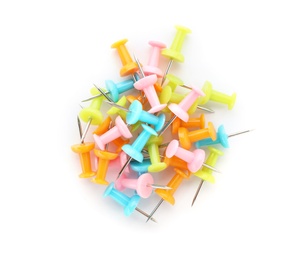 Heap of colorful push pins on white background. School stationery