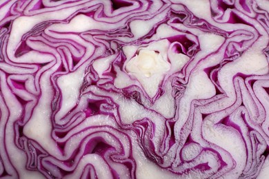 Photo of Cut red cabbage as background, closeup view