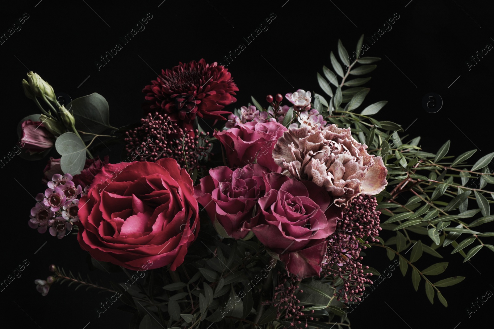 Photo of Beautiful bouquet of different flowers on black background. Floral card design with dark vintage effect