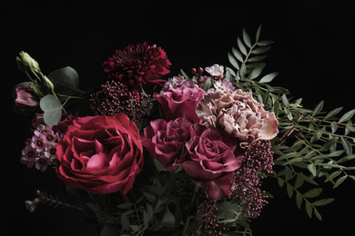 Beautiful bouquet of different flowers on black background. Floral card design with dark vintage effect