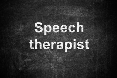 Image of Text Speech Therapist written on dirty black chalkboard 