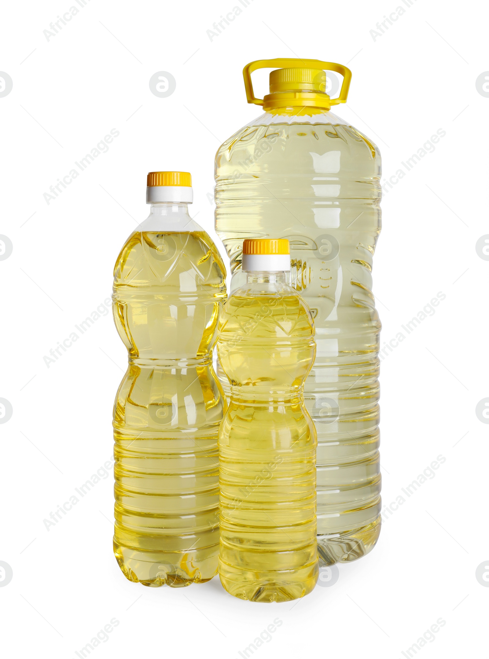 Photo of Bottles of cooking oil on white background