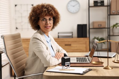 Notary in glasses at workplace in office