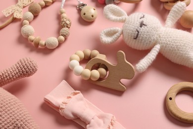 Different baby accessories on pink background, closeup