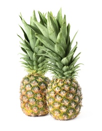 Photo of Fresh ripe juicy pineapples isolated on white