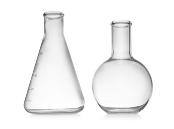 Photo of Set of empty laboratory glassware on white background