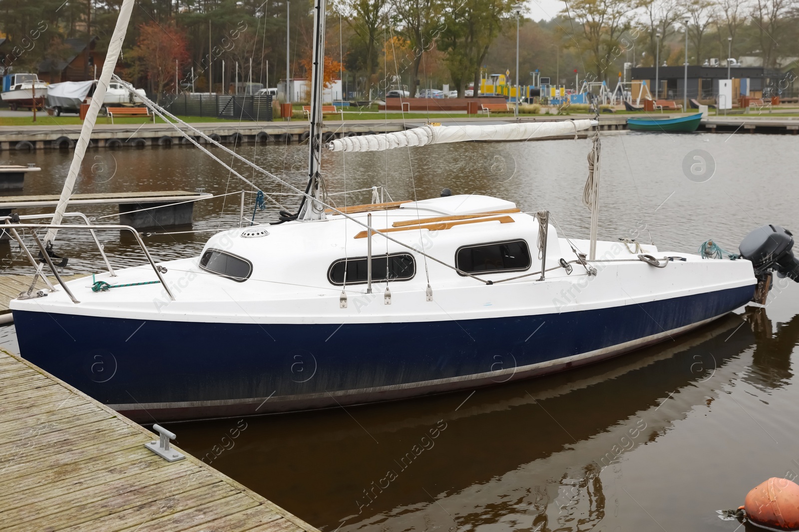 Photo of Picturesque view of pier with moored boat