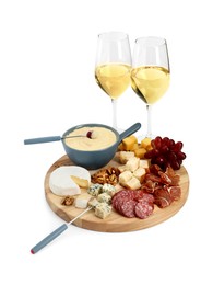 Photo of Fondue with tasty melted cheese, forks, different snacks and wine isolated on white