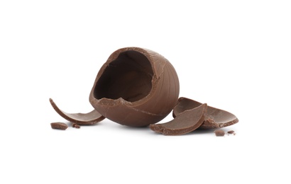 Photo of Broken milk chocolate egg on white background