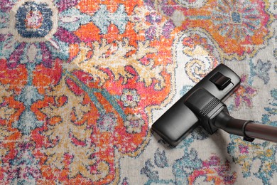 Image of Hoovering carpet with vacuum cleaner, above view and space for text. Clean trace on dirty surface