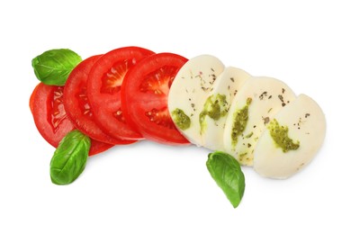 Photo of Tasty salad Caprese with mozzarella, tomatoes, basil and pesto sauce isolated on white, top view