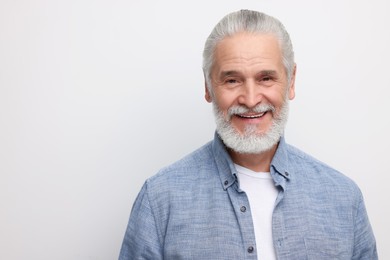 Portrait of handsome senior man on white background. Space for text