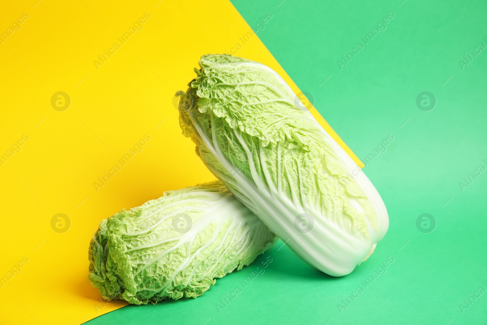 Photo of Fresh ripe cabbages on color background