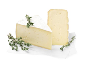 Photo of Piece of tasty camembert cheese and thyme isolated on white