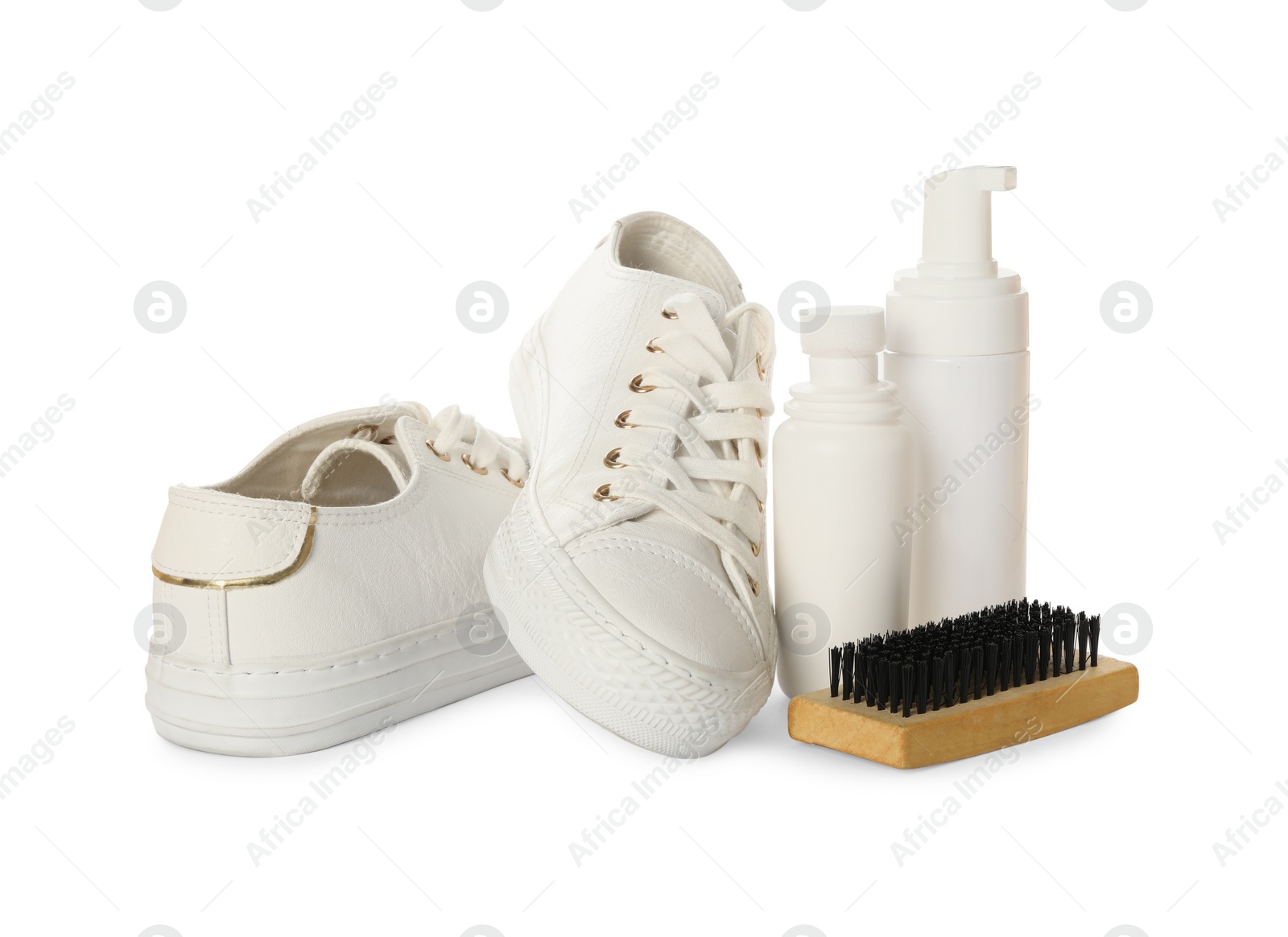 Photo of Stylish footwear and shoe care accessories on white background