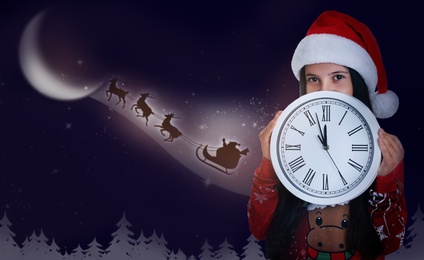 Image of Cute little child and Santa Claus flying in his sleigh against moon sky on background