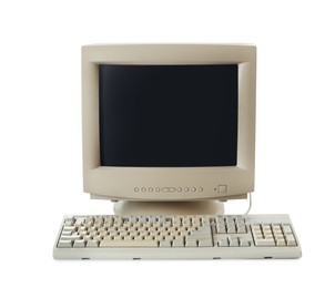 Photo of Old computer monitor and keyboard on white background