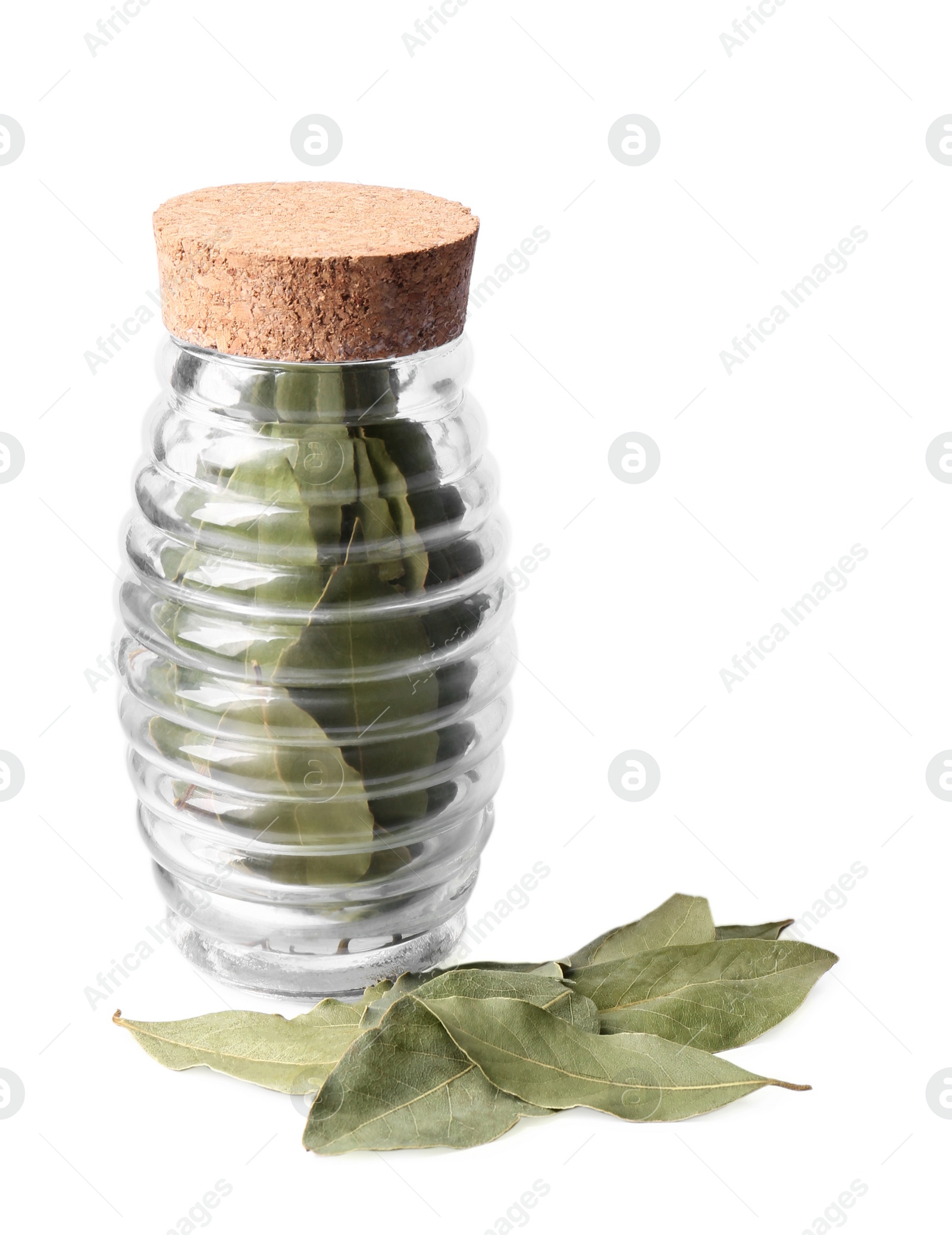 Photo of Aromatic bay leaves in glass jar on white background