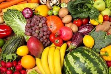 Assortment of organic fresh fruits and vegetables as background, closeup