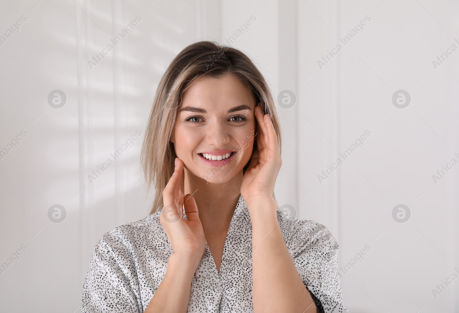 Photo of Portrait of beautiful young woman in room