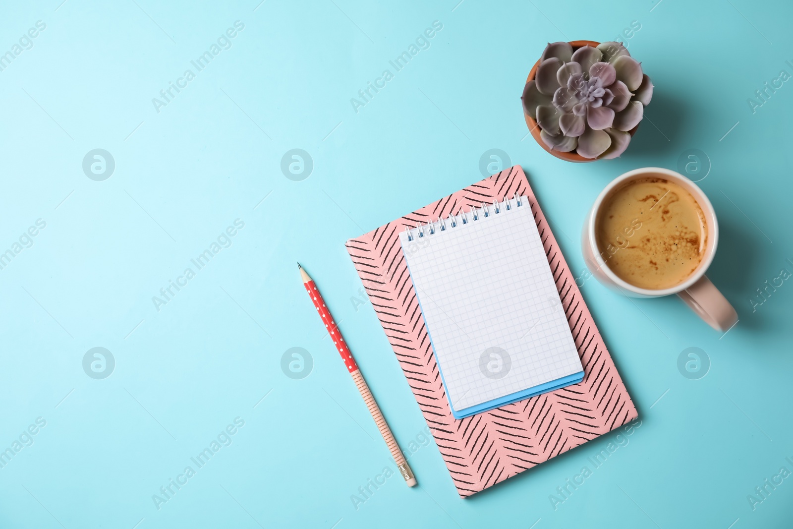 Photo of Flat lay composition with notebooks, coffee and space for text on color background