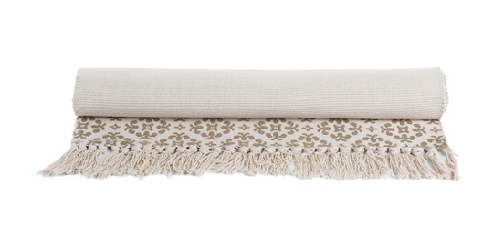 Rolled carpet with ornament on white background. Interior element