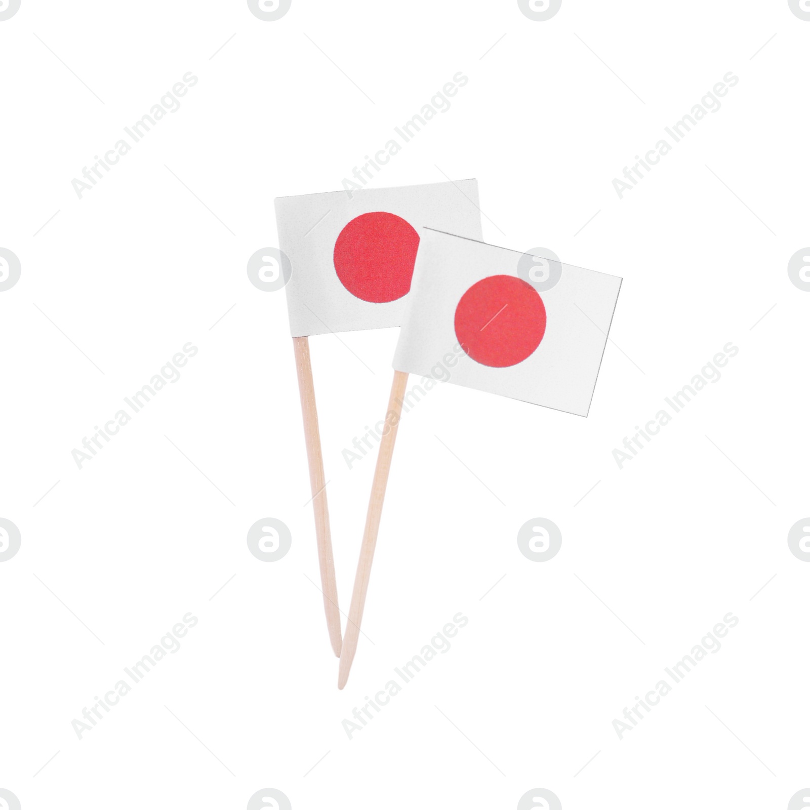 Photo of Small paper flags of Japan on white background