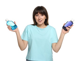 Photo of Young woman with different types of mouthwash on white background