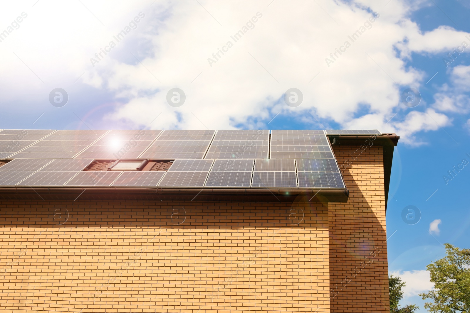 Photo of Building with installed solar panels on roof. Alternative energy source