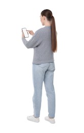 Photo of Woman using smartphone with blank screen on white background