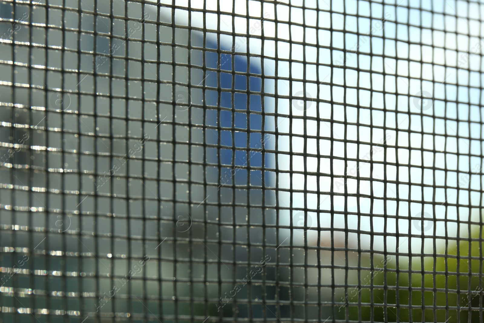 Photo of Closeup of mosquito window screen, view from inside