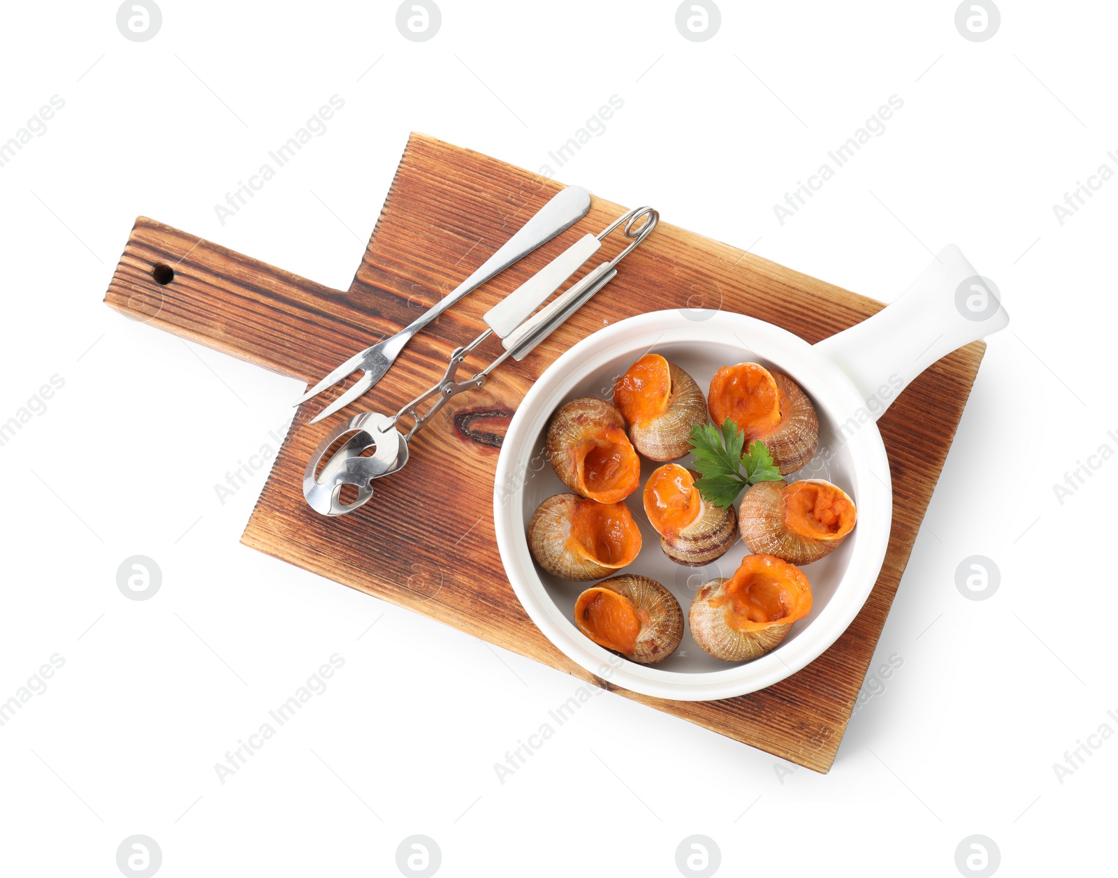 Photo of Delicious cooked snails with parsley and tools isolated on white, top view