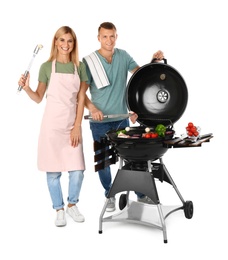 Happy couple cooking on barbecue grill, white background