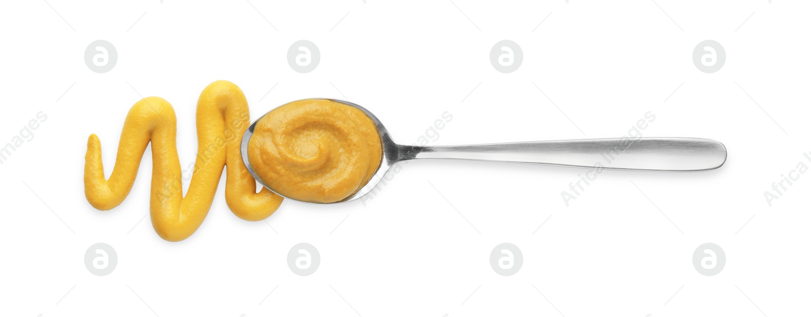 Photo of Fresh mustard sauce and spoon isolated on white, top view