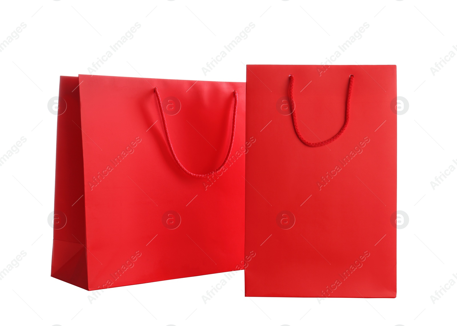 Photo of Red paper shopping bags isolated on white