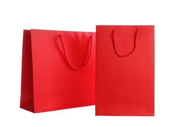 Red paper shopping bags isolated on white