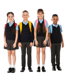 Full length portrait of cute children in school uniform on white background