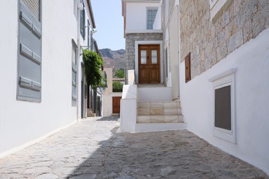 Photo of City street with beautiful buildings on sunny day