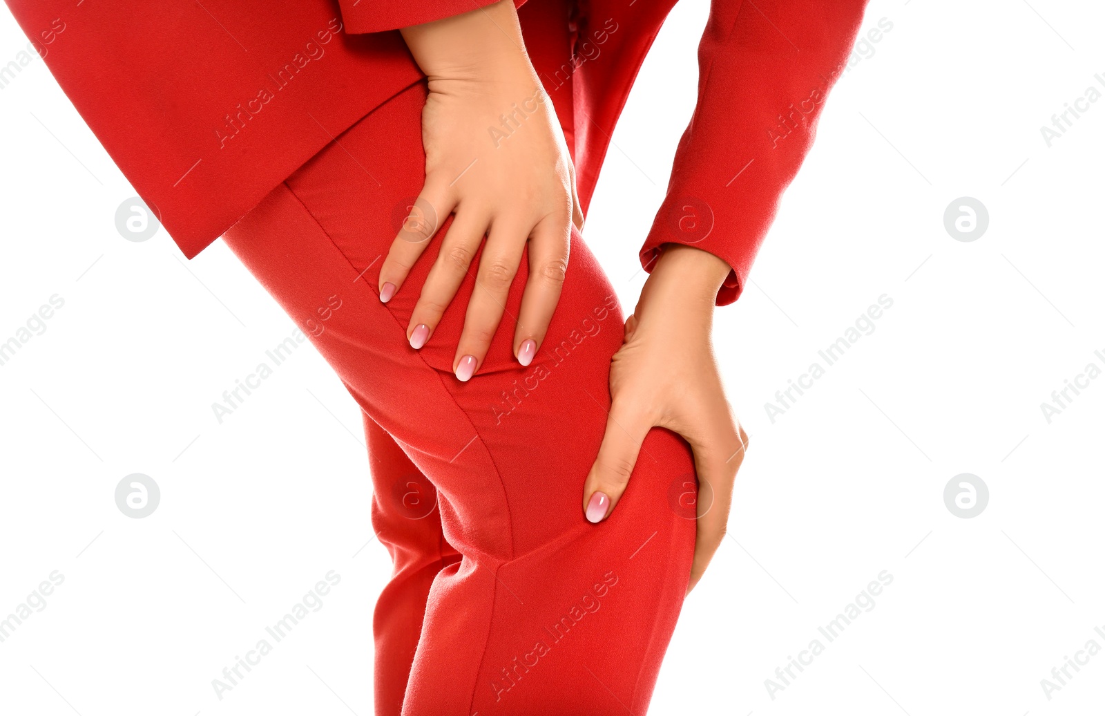 Photo of Woman suffering from knee pain on white background, closeup