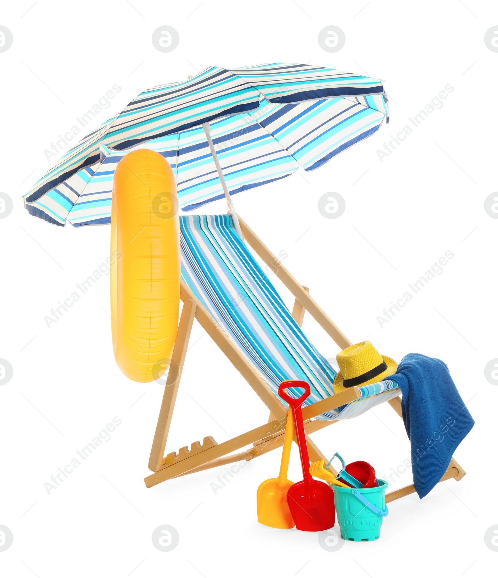 Photo of Beach umbrella, deck chair, inflatable ring, hat, towel and child's sand toys on white background