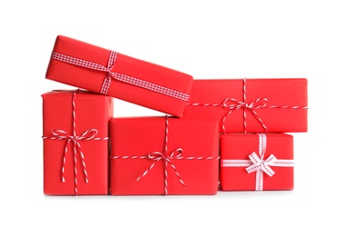 Photo of Beautifully wrapped gift boxes on white background