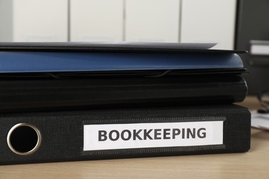 Photo of Stack of folders on desk in office, closeup. Bookkeeper's workplace