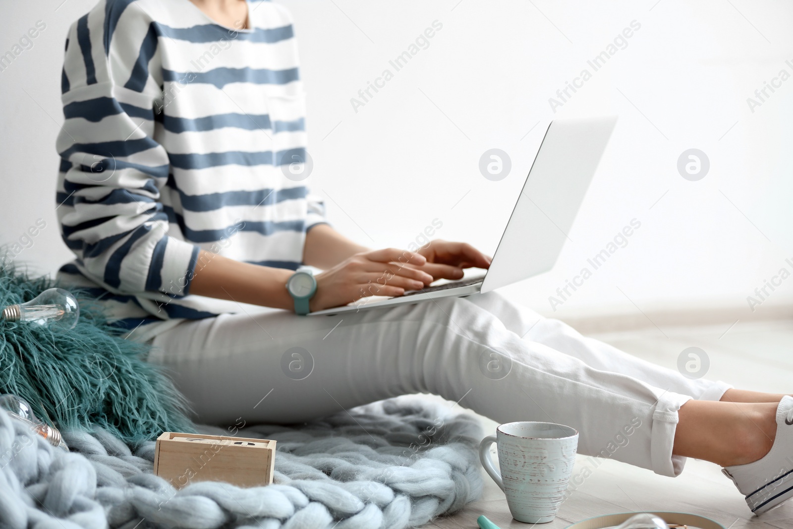 Photo of Female blogger with laptop indoors